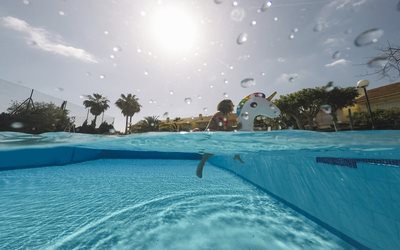 How Weather Affects Pool Chemistry: Adjusting Your Pool Care for Rain, Heat, and Storms